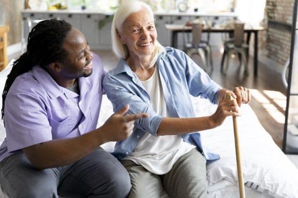 caregiver and senior woman small