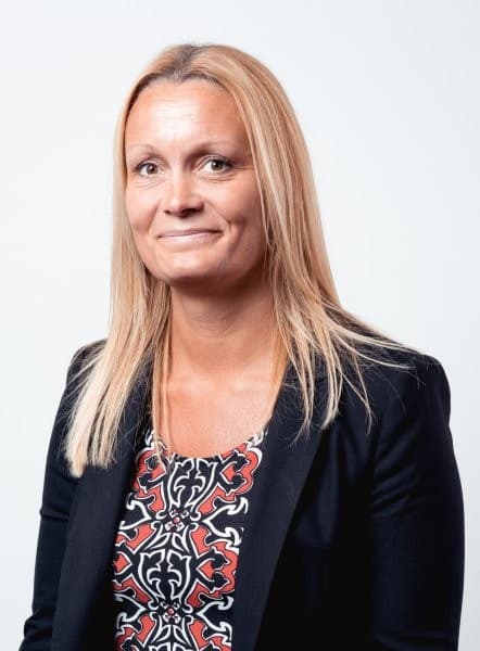 Studio portrait of Ilva Rupenthal wearing a patterned top and black jacket