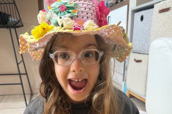 Happy young girl Saffie wearing glasses
