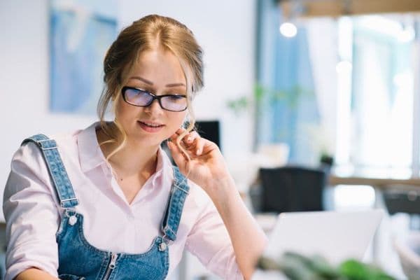 woman glasses working office