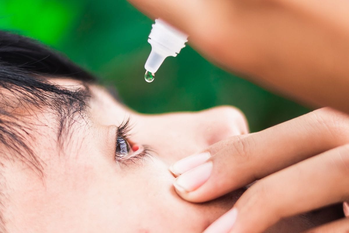boy dropping eye drop