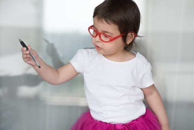 toddler girl wearing red glasses small