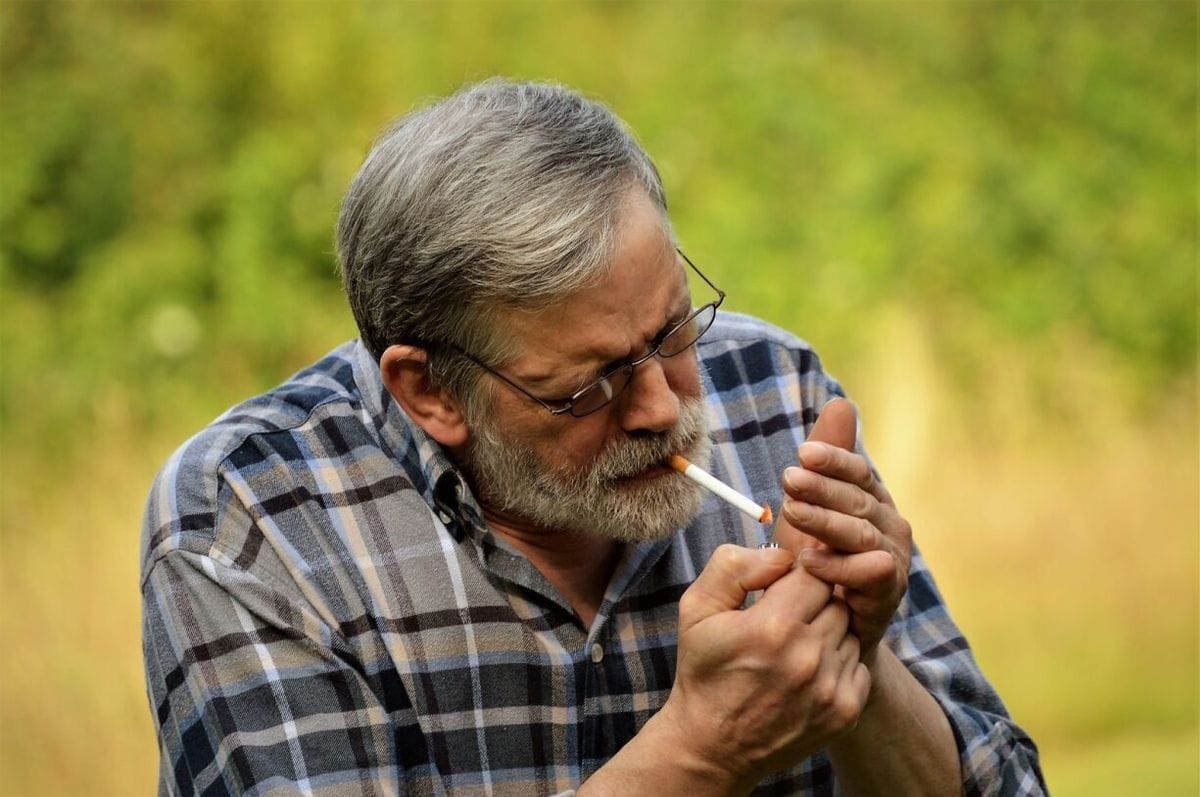 senior male smoking