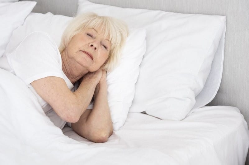 woman sleeping her bed small