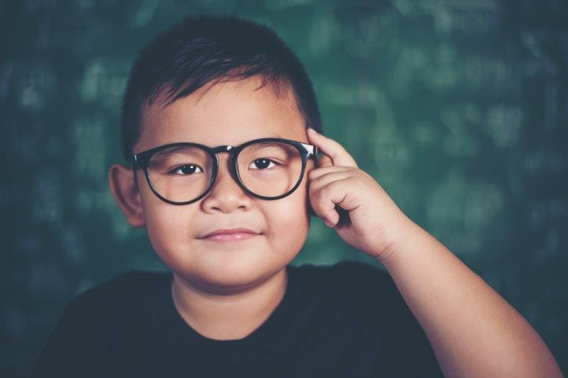 yxgbtrhk asian boy with book near school board glasses