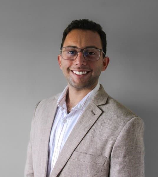 Studio portrait of Vihan Dilal wearing a suit and a white shirt