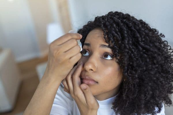 eye drops black woman