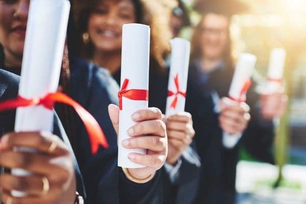 graduation hands students with diploma online
