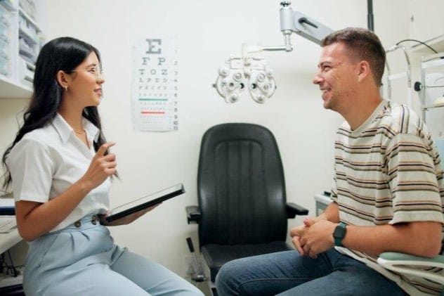 optometry woman with patient clinic consulting eye exam small