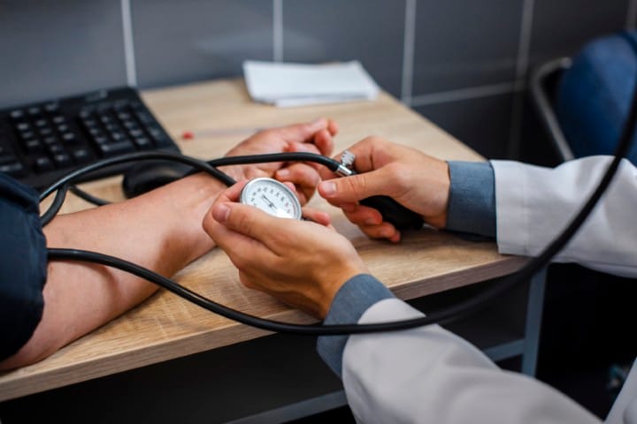 doctor hands measuring blood pressure